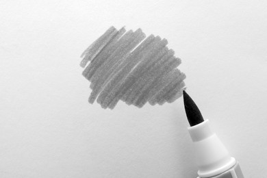 Photo of Stroke drawn with gray marker and highlighter isolated on white, top view