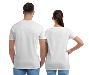 Young couple in t-shirts on white background. Mockup for design