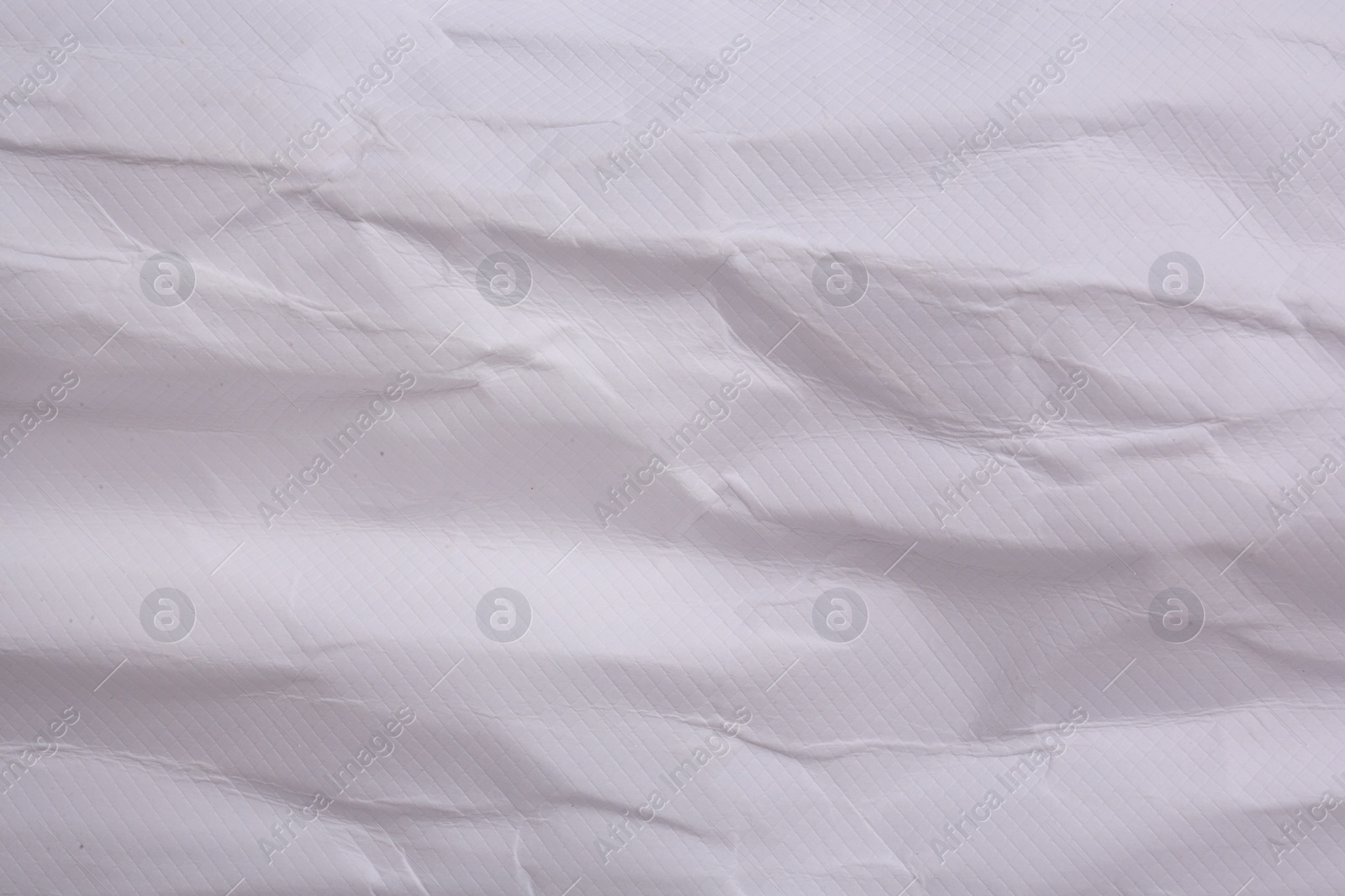 Photo of Texture of crumpled parchment paper as background, top view