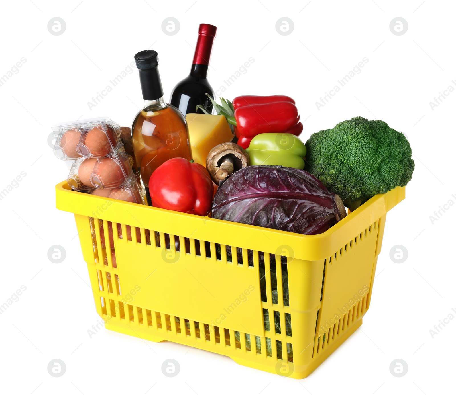 Photo of Shopping basket with grocery products on white background