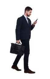 Handsome bearded businessman in suit with smartphone and briefcase on white background