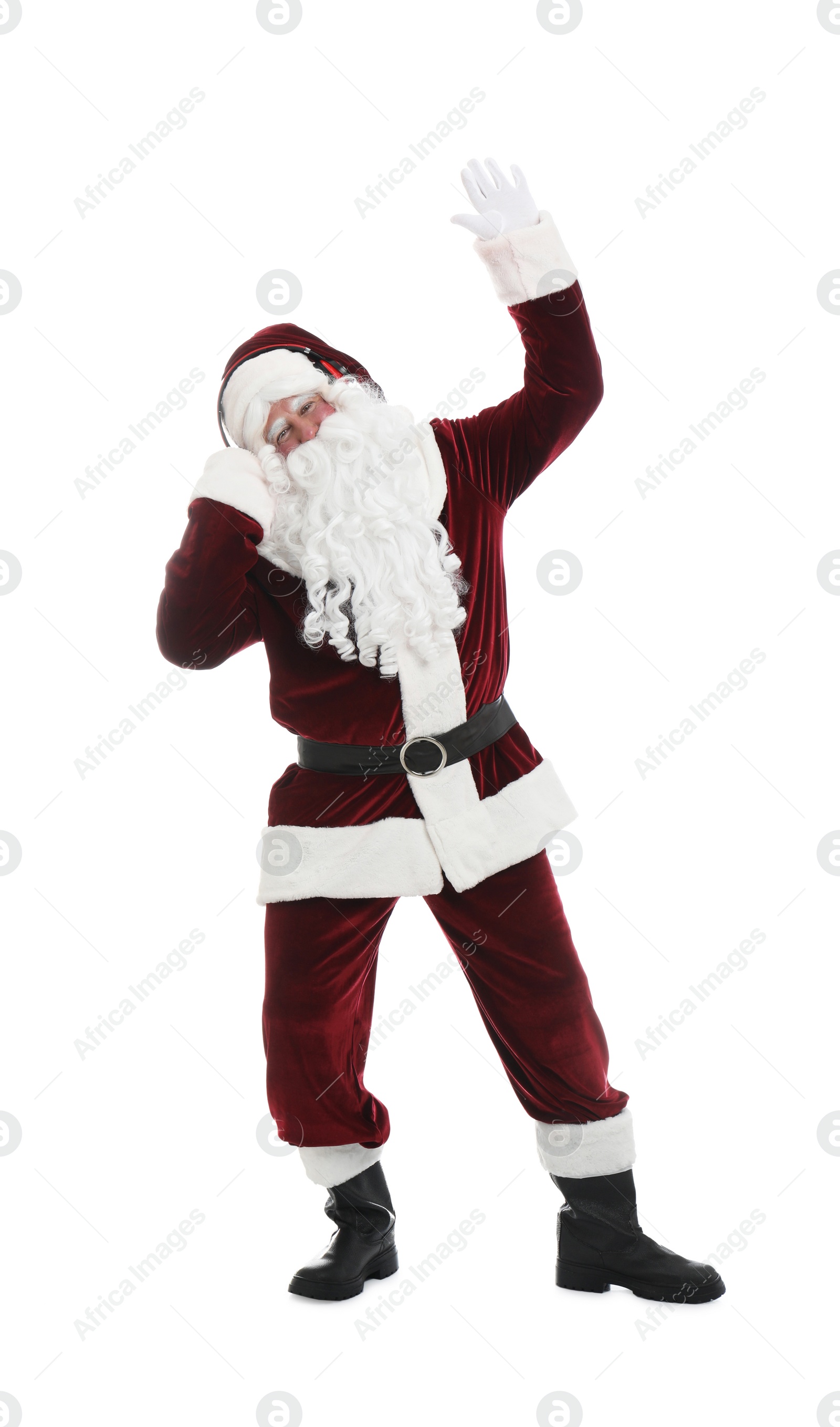 Photo of Santa Claus with headphones listening to Christmas music on white background