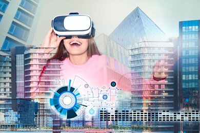 Image of Double exposure of woman using virtual reality headset and cityscape. Modern technology