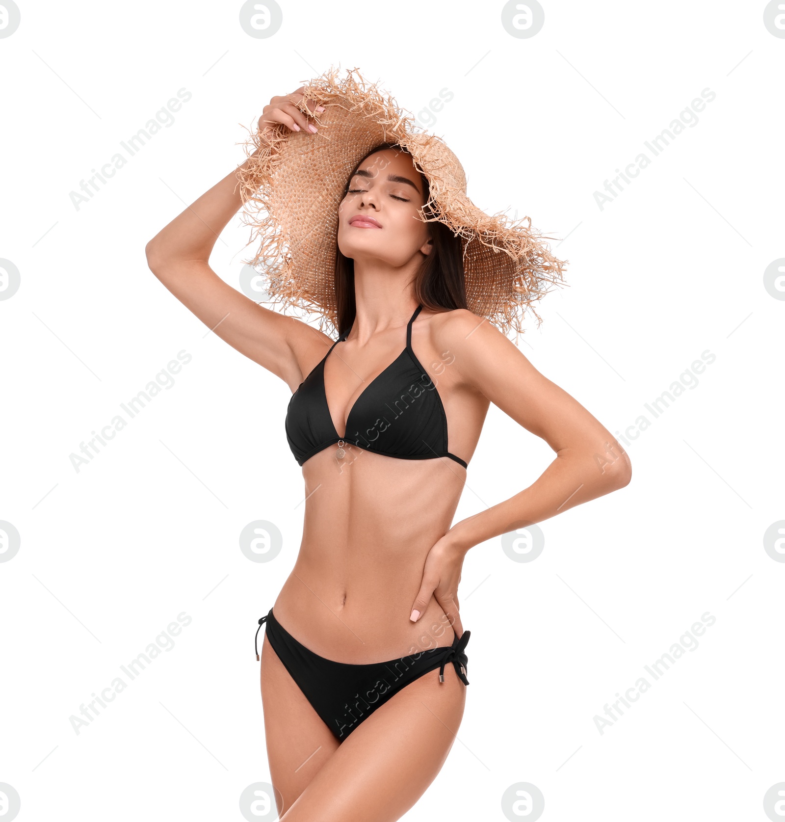 Photo of Young woman in stylish bikini and straw hat isolated on white