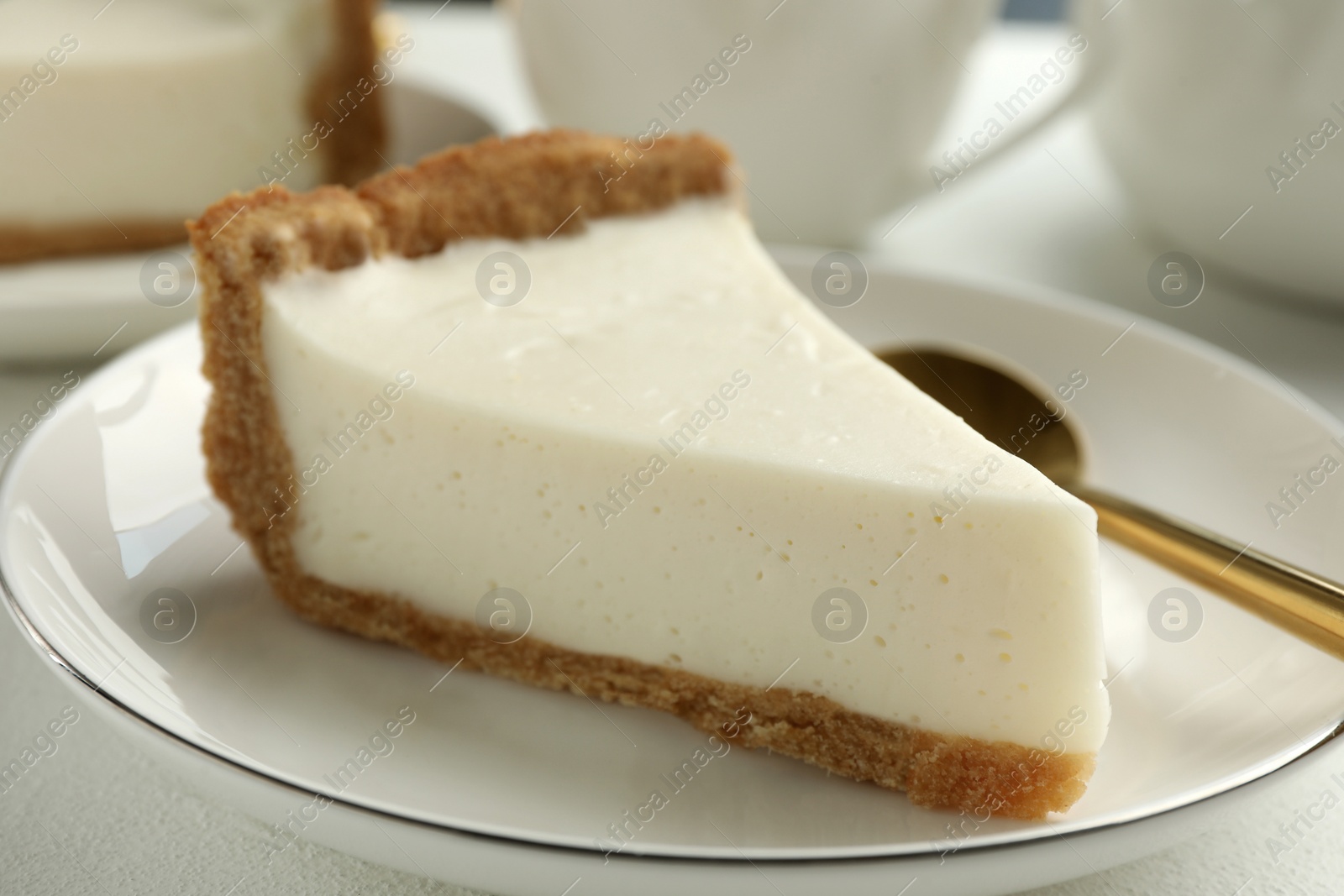 Photo of Piece of tasty vegan tofu cheesecake on table, closeup