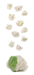 Image of Many fresh cauliflower florets falling on white background