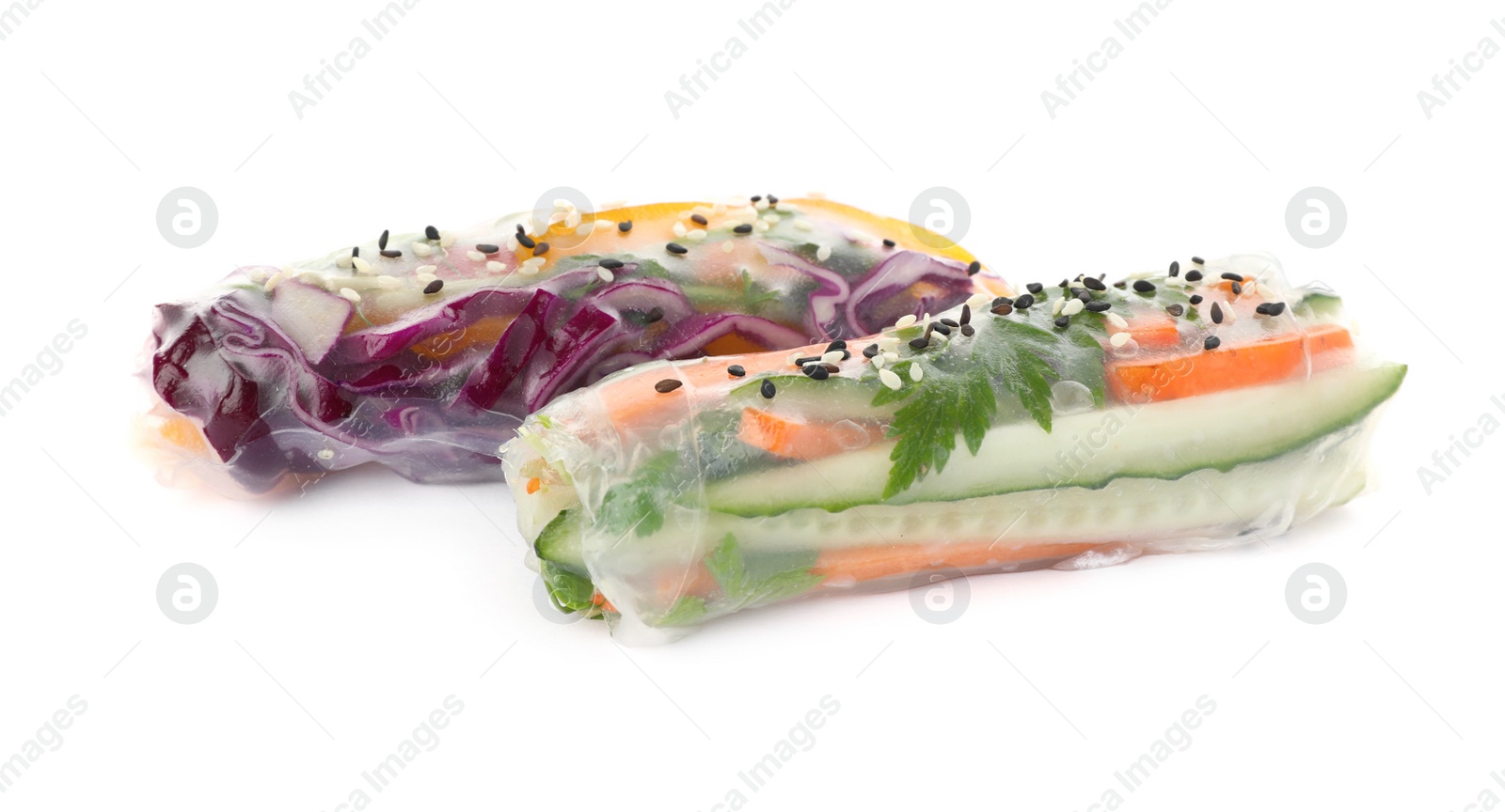 Photo of Different rolls wrapped in rice paper on white background, closeup