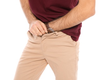 Man scratching crotch on white background, closeup. Annoying itch