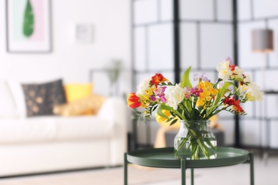 Photo of Beautiful bouquet of freesia flowers indoors