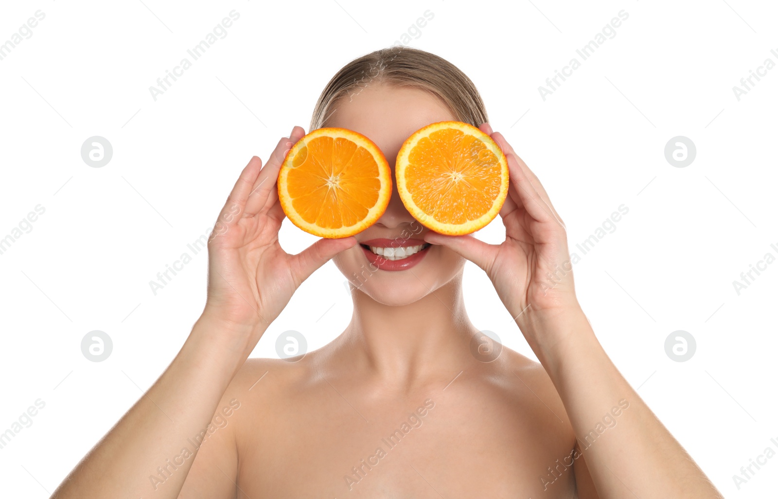 Photo of Young woman with cut orange on white background. Vitamin rich food