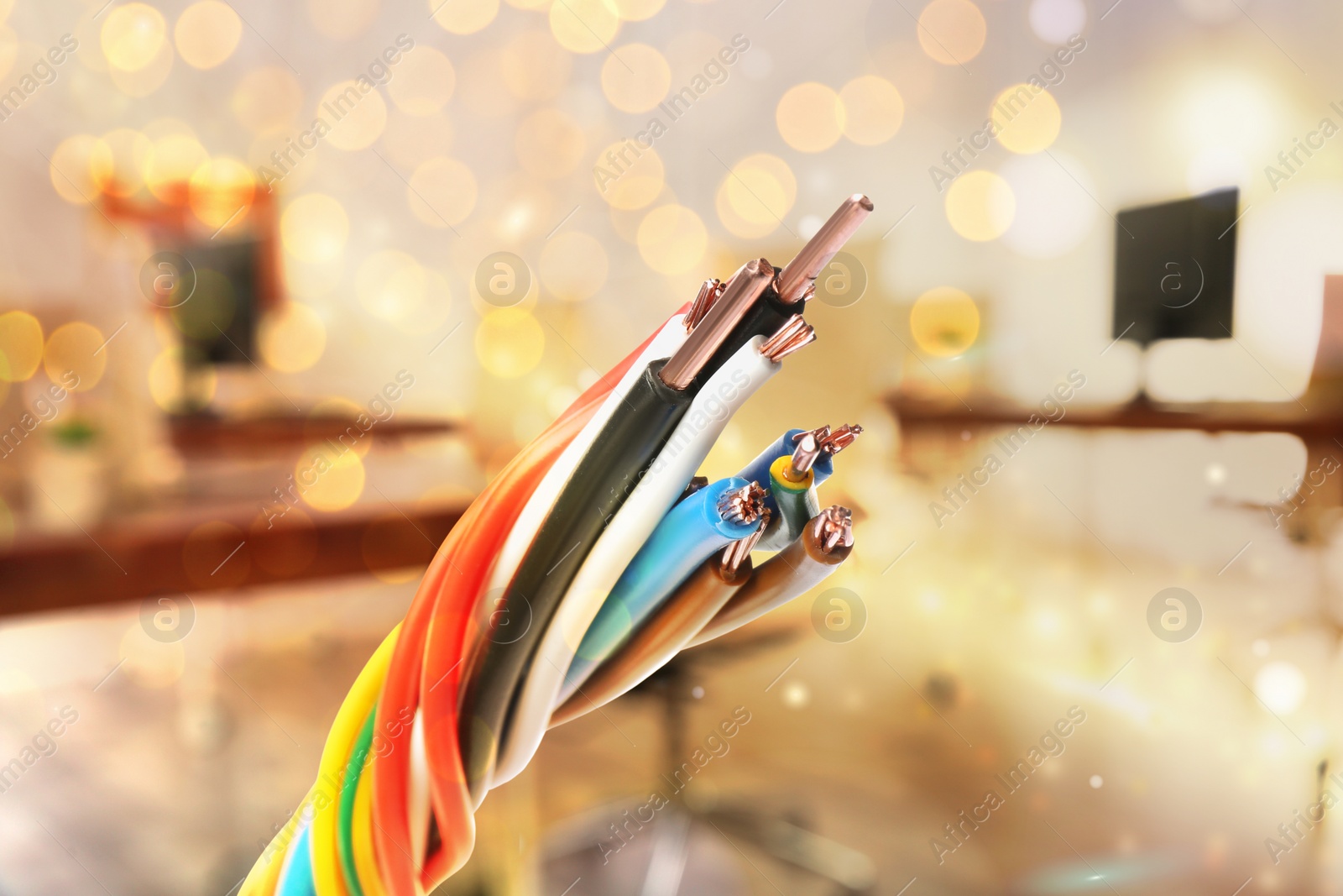 Image of Colorful electrical wires against blurred background, closeup. Bokeh effect