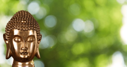 Image of Golden Buddha sculpture outdoors, space for text. Banner design