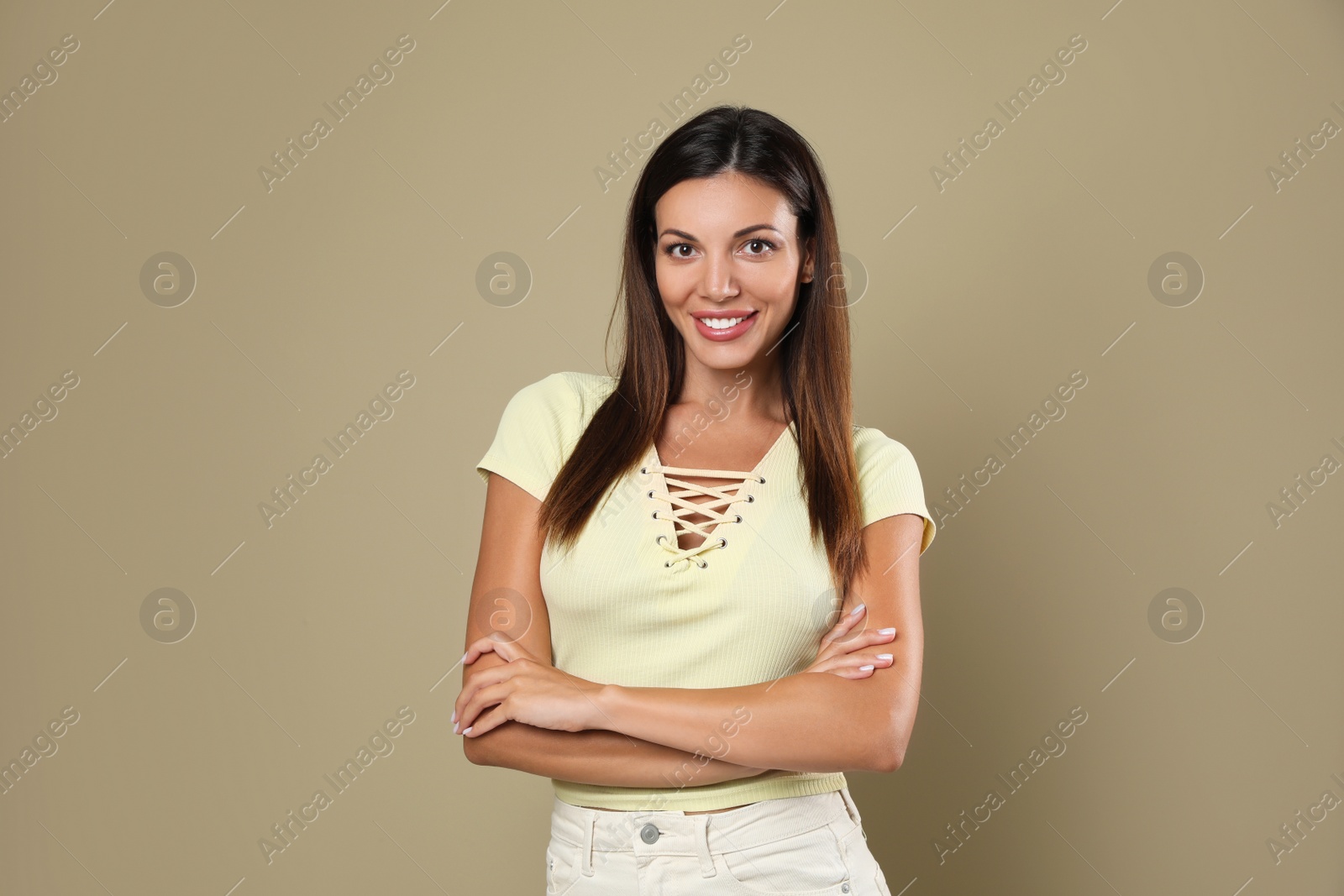 Photo of Portrait of beautiful woman on beige background