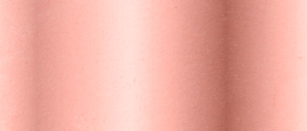 Rose gold surface as background, closeup view