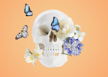 Image of White skull with fresh flowers and beautiful butterflies on light orange background