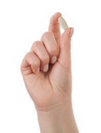 Photo of Woman holding vitamin pill on white background, closeup. Health supplement