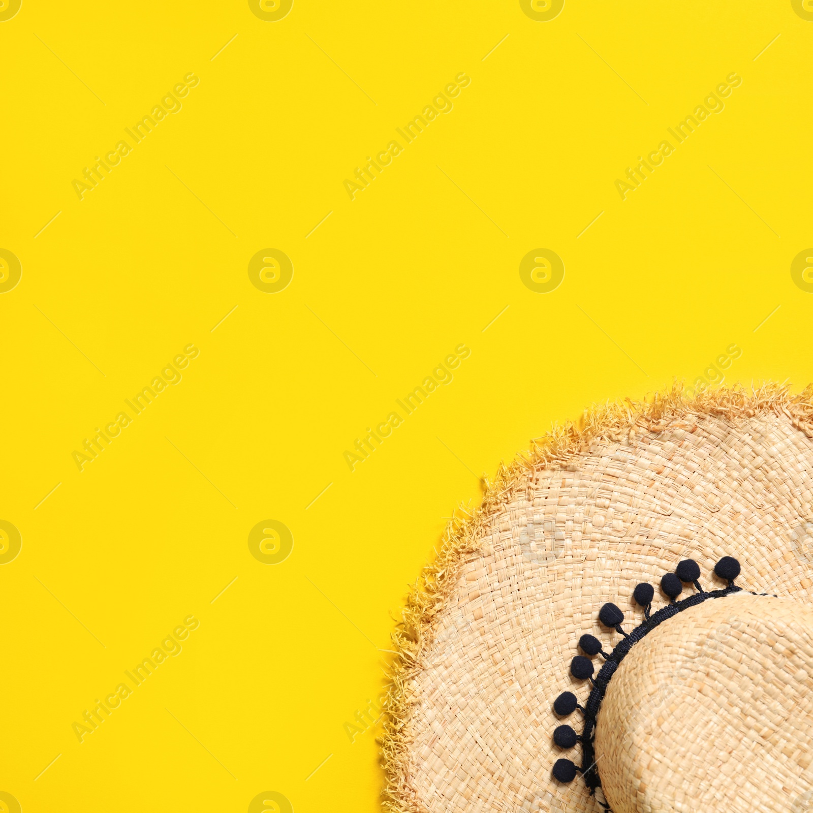 Photo of Stylish straw hat on color background, top view with space for text. Beach accessories