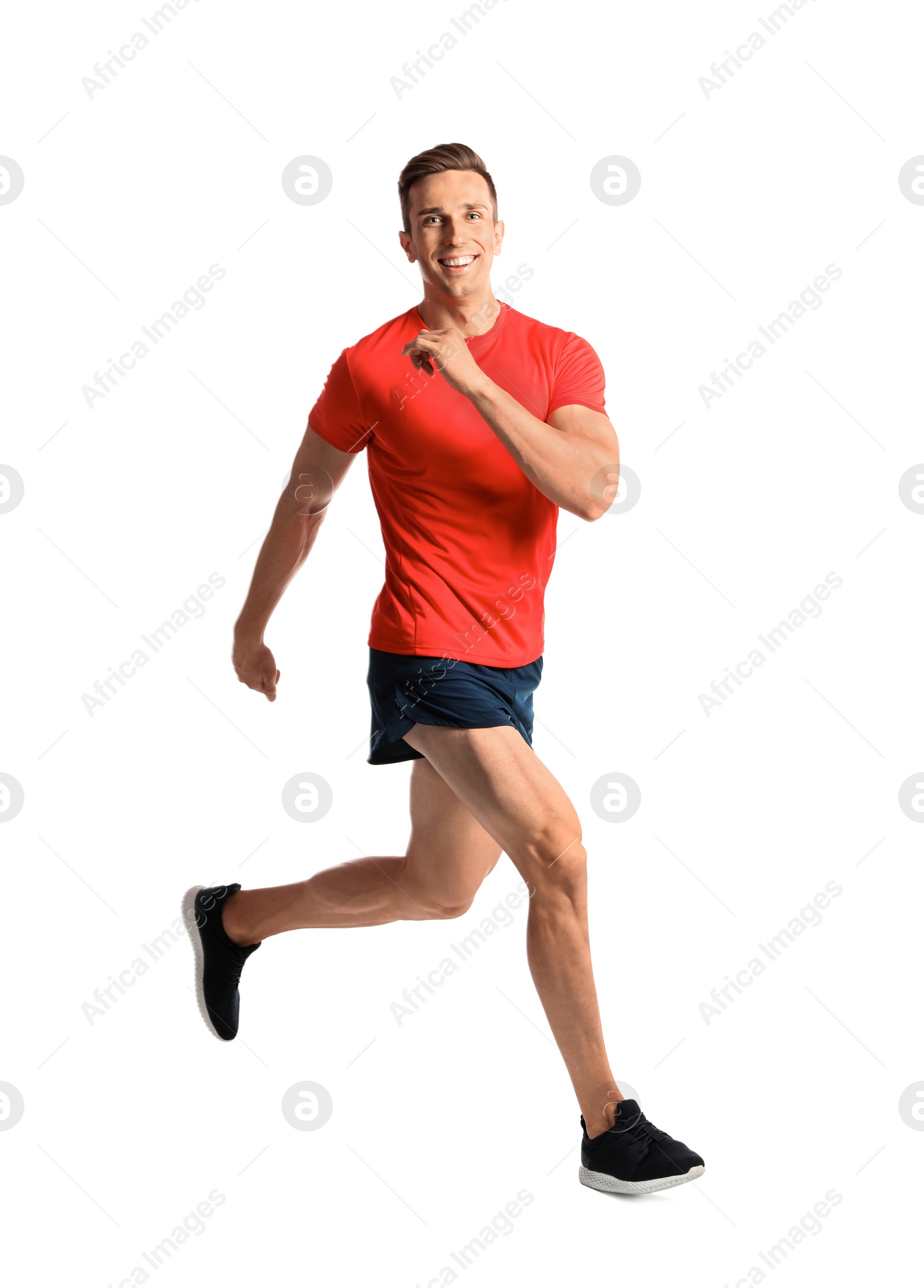 Photo of Sporty young man running on white background