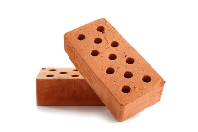 Photo of New cored bricks on white background. Construction industry