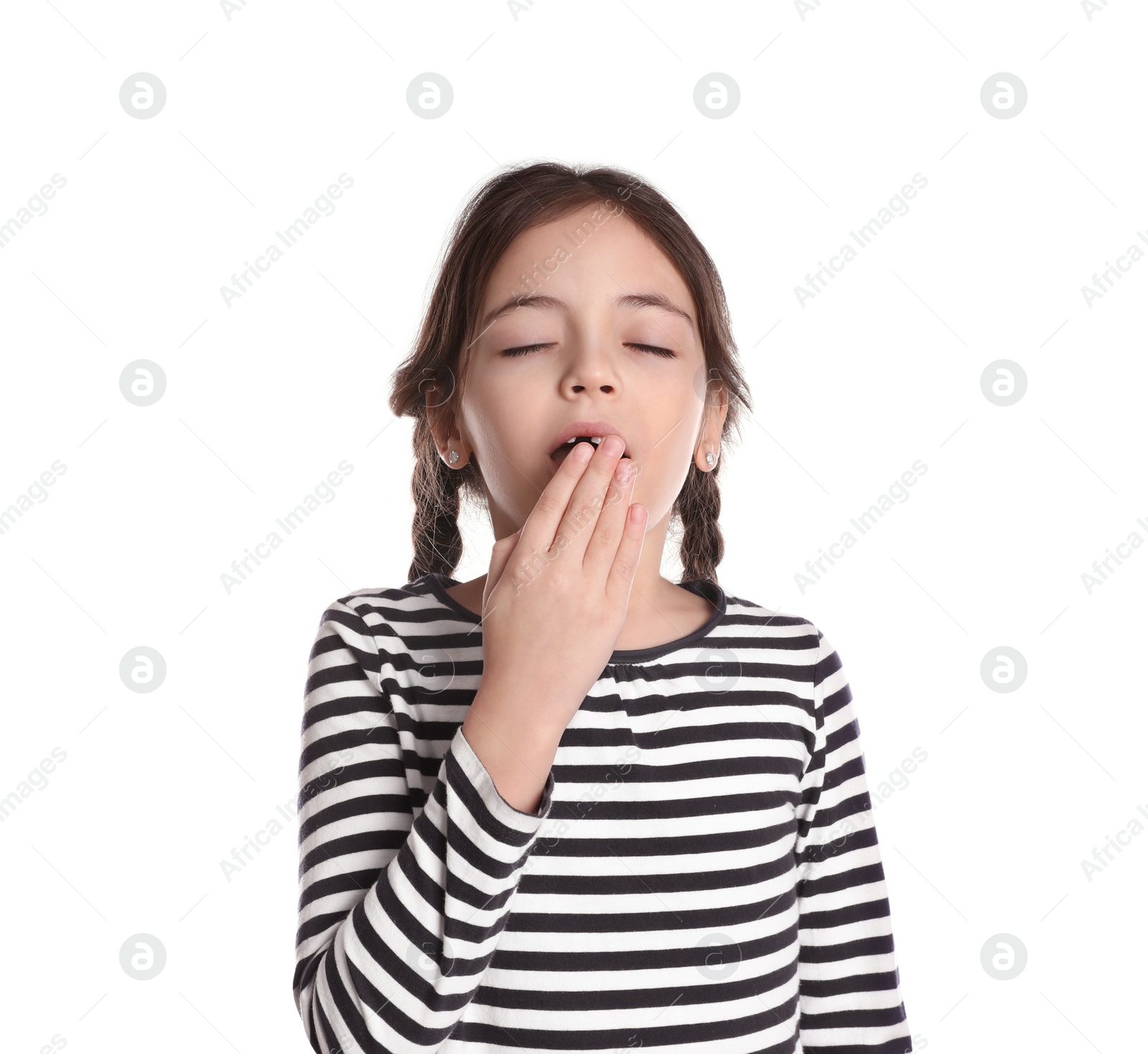 Photo of Sleepy little girl yawning on white background