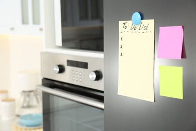 Photo of Blank To do list and sticky notes on fridge in kitchen. Space for text