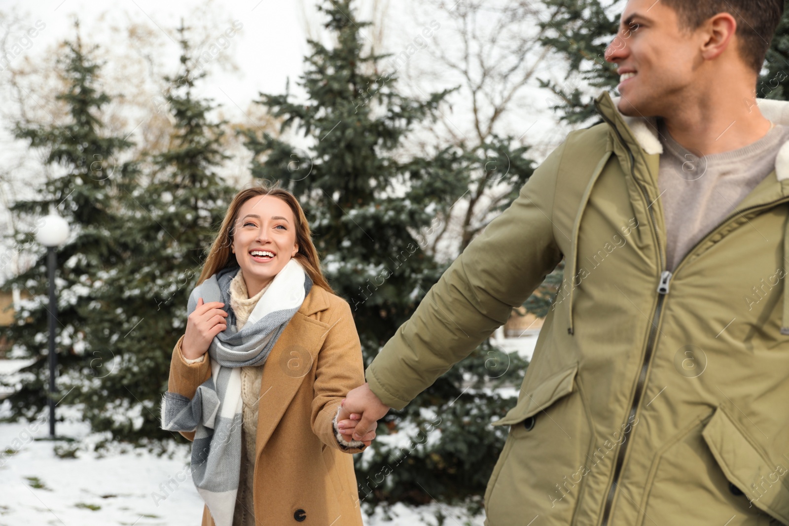 Photo of Beautiful happy couple outdoors on winter day