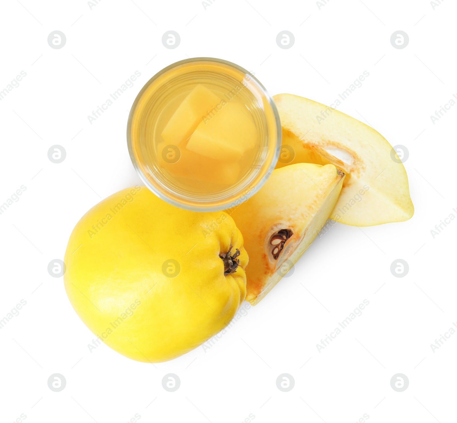 Photo of Delicious quince drink in glass and fresh fruits isolated on white, top view