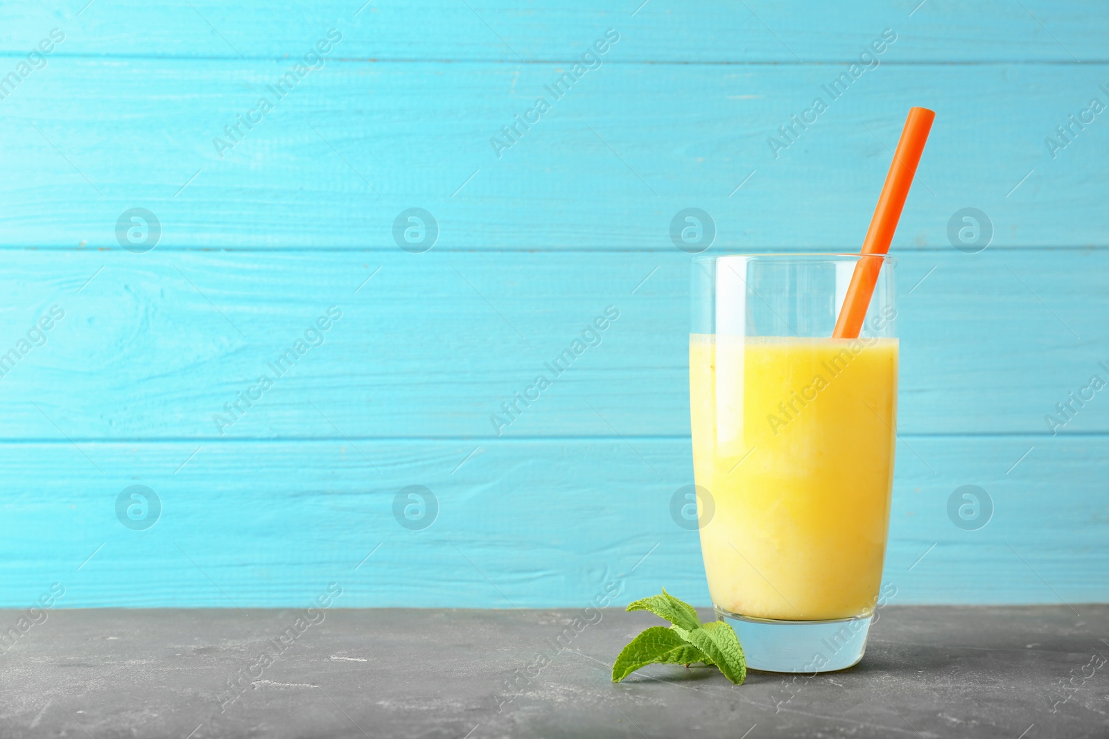 Photo of Glass with delicious detox smoothie on table