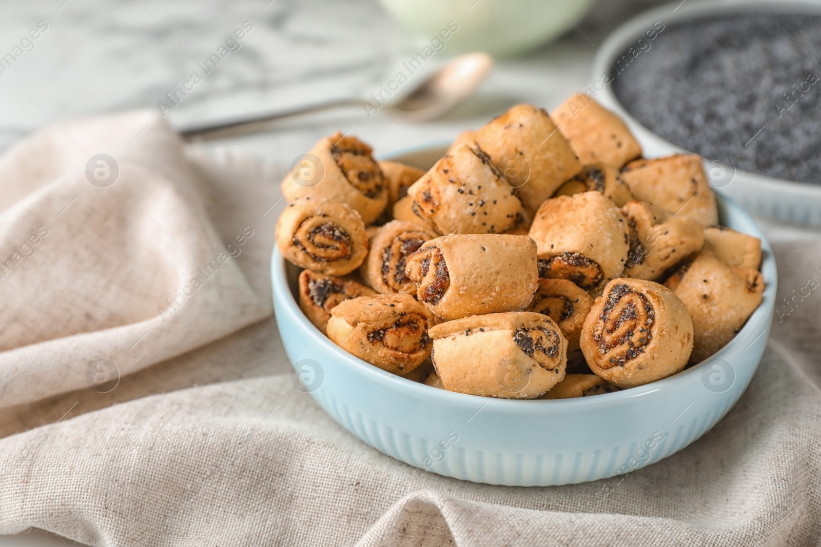 Photo of Tasty sweet cookies with poppy seeds on table