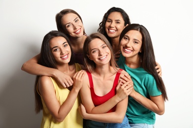 Photo of Happy women on white background. Girl power concept