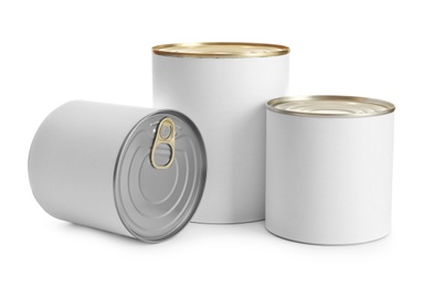 Photo of Closed tin cans isolated on white, mockup for design