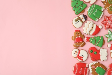 Photo of Different Christmas gingerbread cookies on pink background, flat lay. Space for text