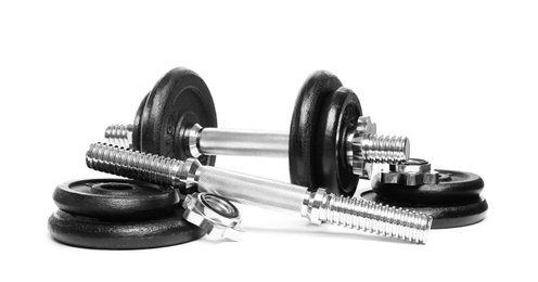 Photo of Professional dumbbell and parts on white background. Sporting equipment