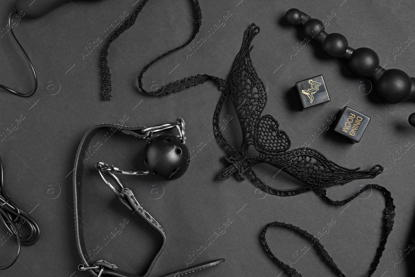 Photo of Different sex toys on black background, flat lay