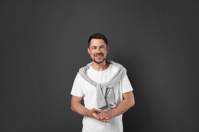 Photo of Portrait of handsome man on dark background