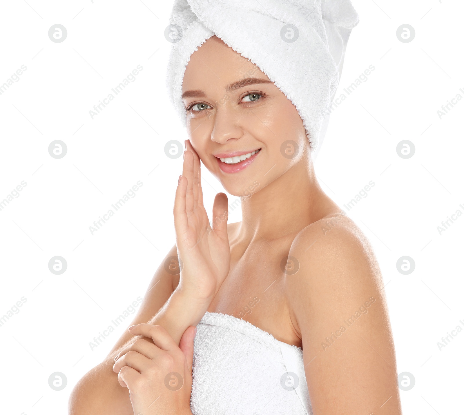 Photo of Portrait of young pretty woman with towels on white background