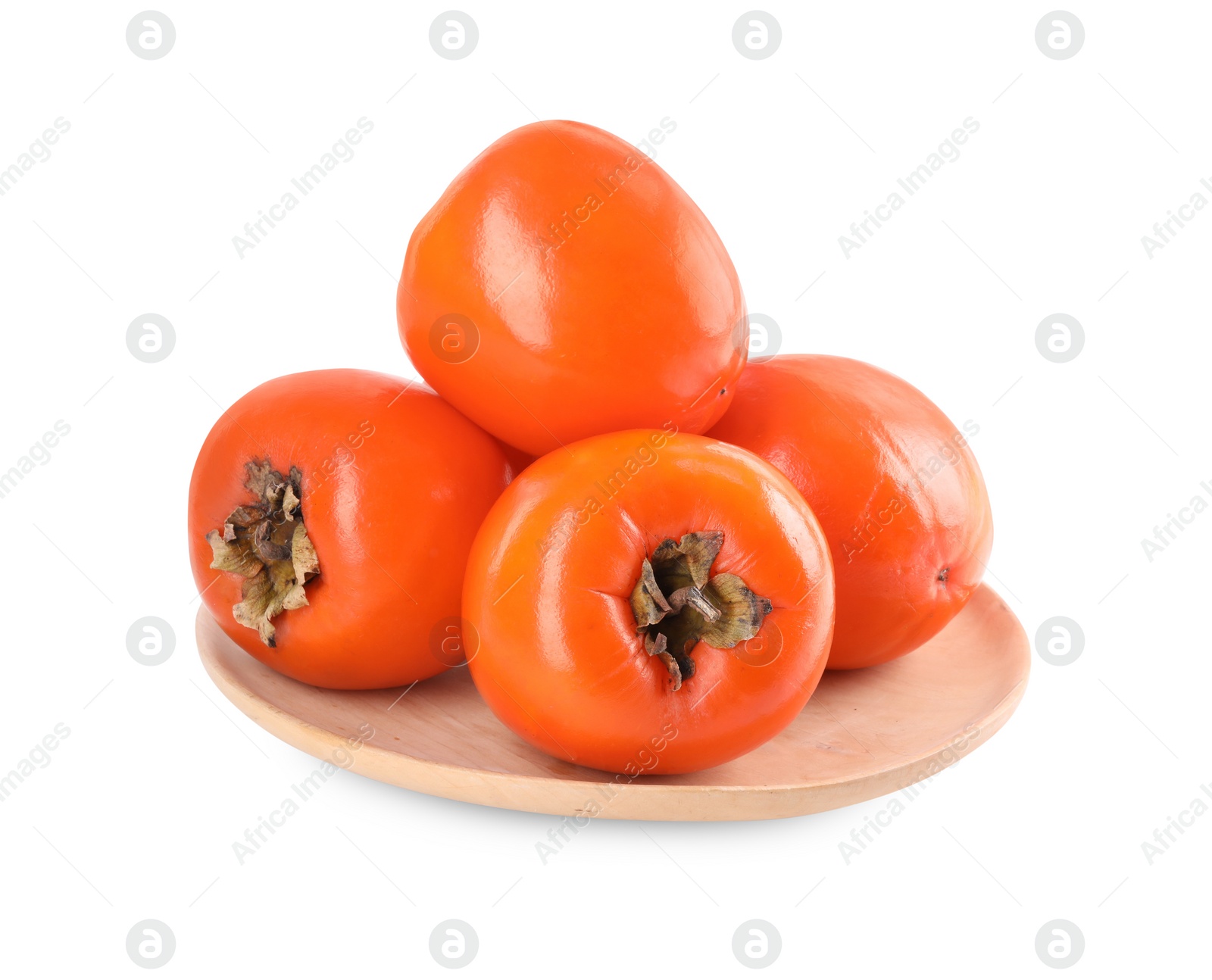 Photo of Delicious ripe juicy persimmons in wooden plate isolated on white