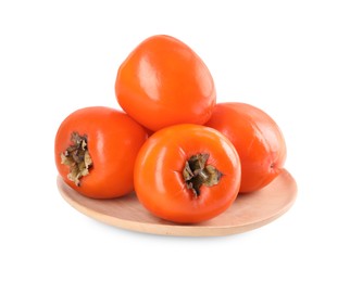 Photo of Delicious ripe juicy persimmons in wooden plate isolated on white