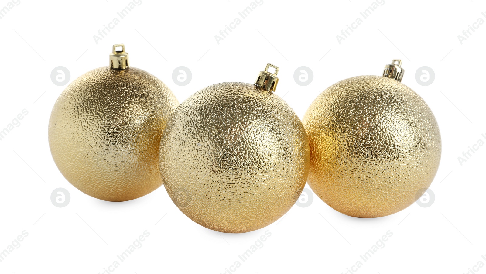 Photo of Beautiful shiny golden Christmas balls on white background