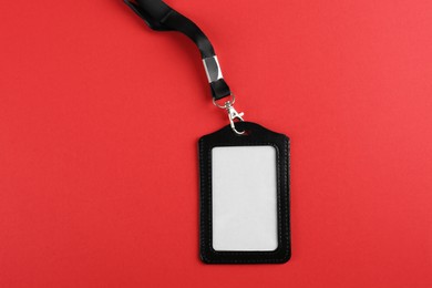 Photo of Blank badge on red background, top view. Mockup for design