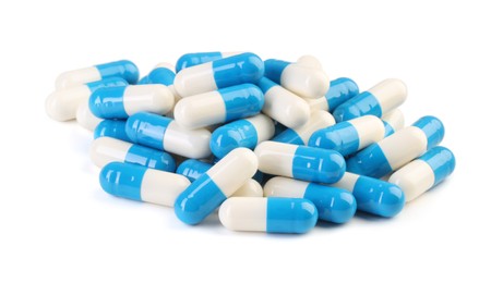 Pile of antibiotic pills isolated on white