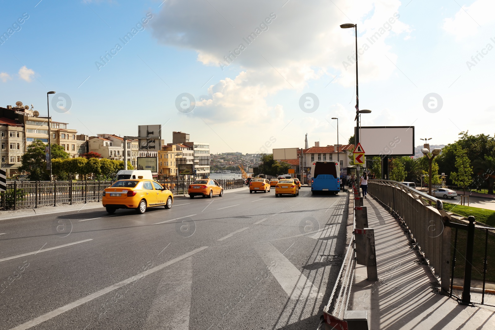 Photo of City road with cars on sunny day