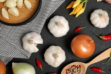 Photo of Flat lay composition with garlic and onion on table