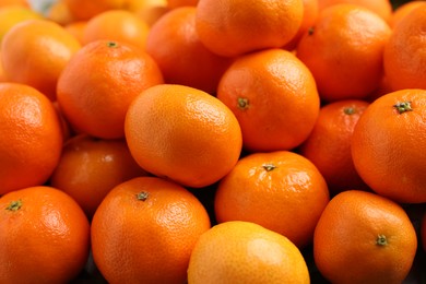 Photo of Delicious fresh tangerines as background, closeup view