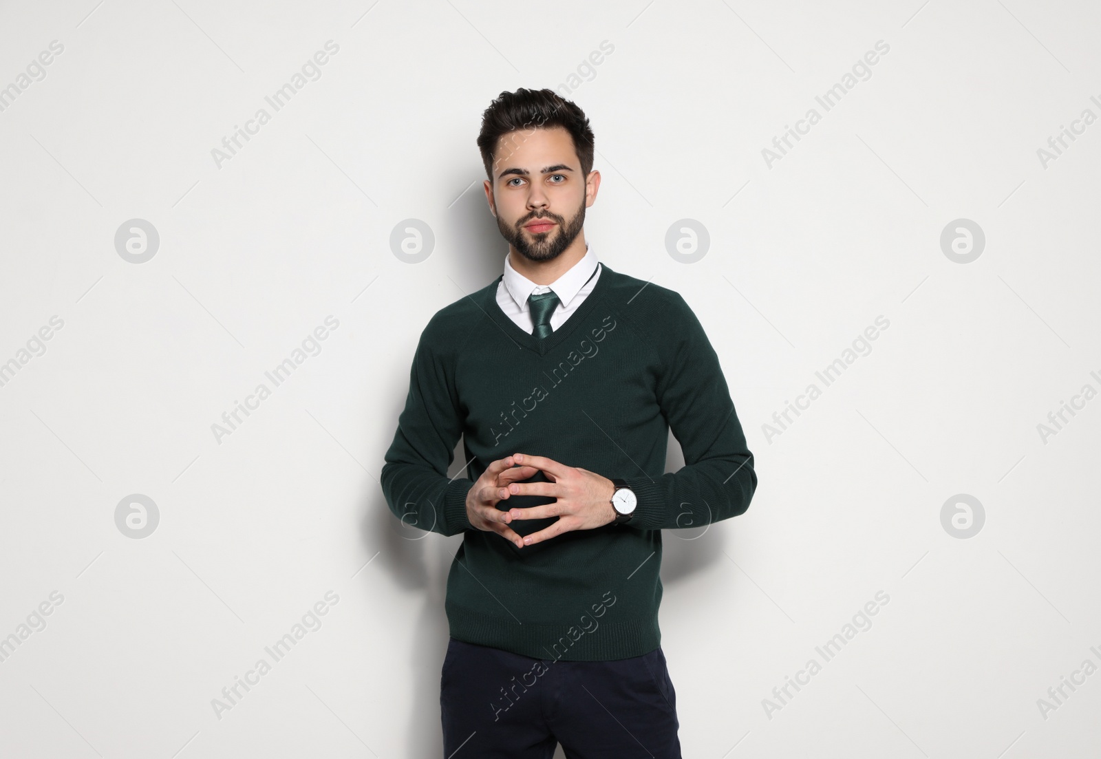 Photo of Portrait of handsome young man on light background