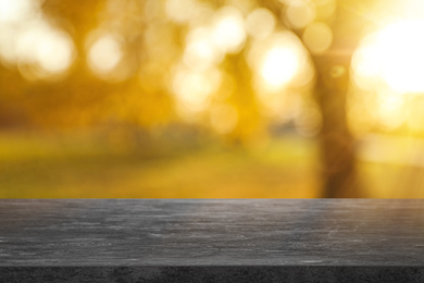 Empty stone surface against blurred background. Bokeh effect