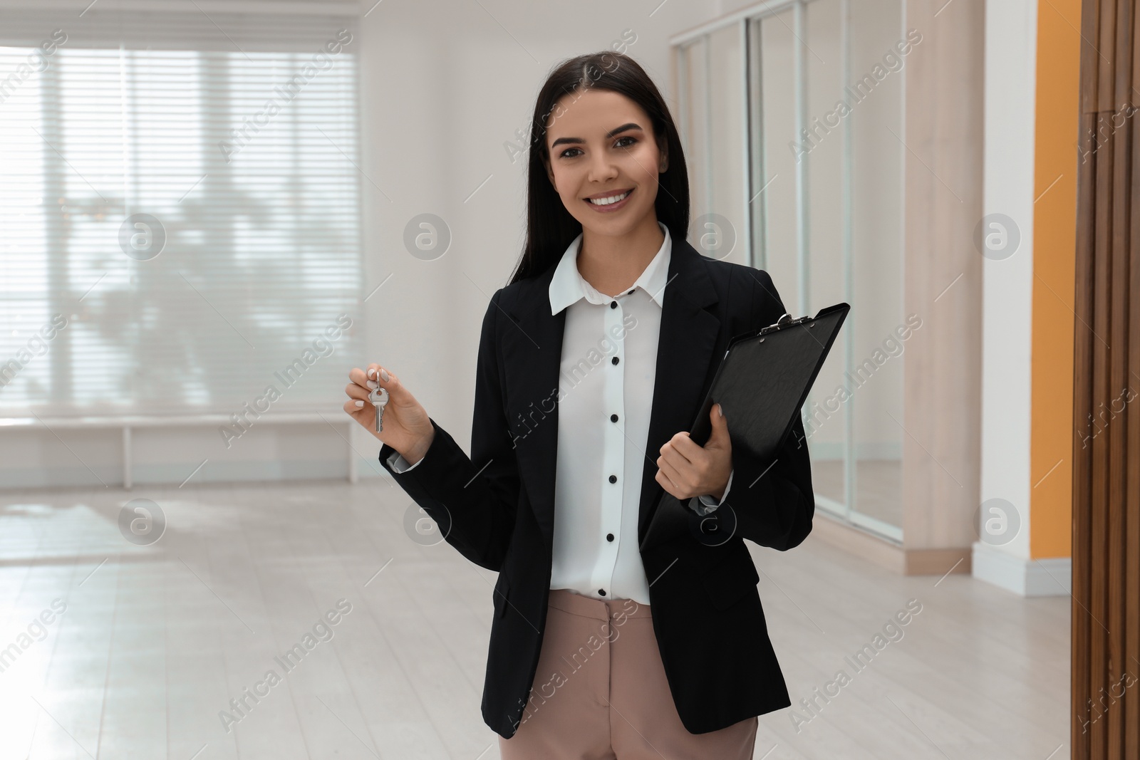 Photo of Female real estate agent showing new apartment