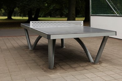 Photo of Metal ping pong table in city park