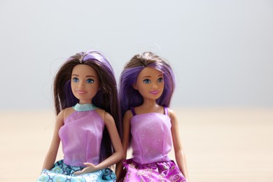 Leiden, Netherlands - September 20, 2023: Beautiful Barbie dolls on light blurred background, space for text