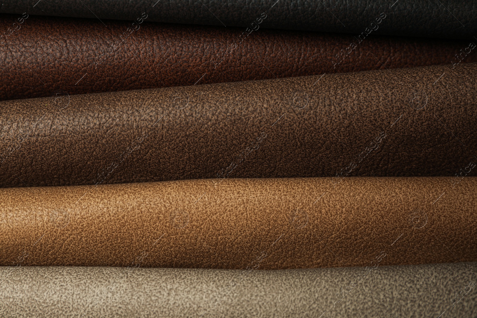 Photo of Different leather samples as background, closeup view